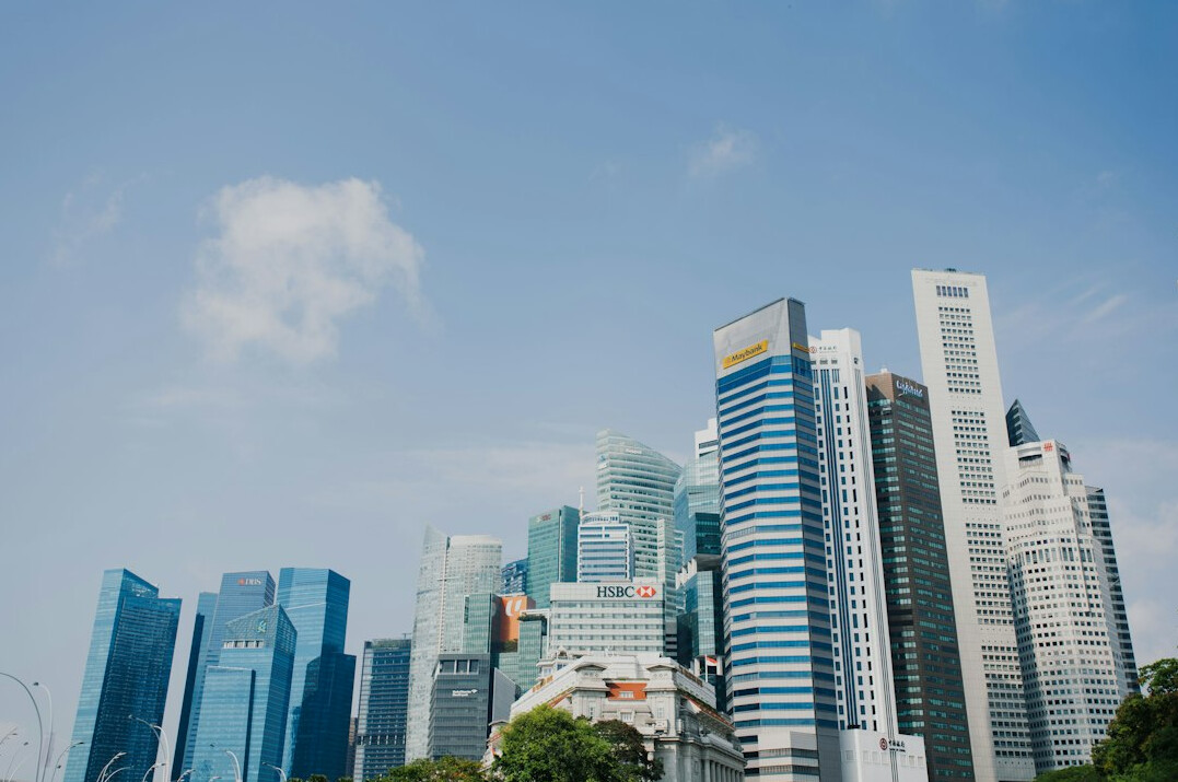 Diverse team of insurance professionals in a Singapore office meeting