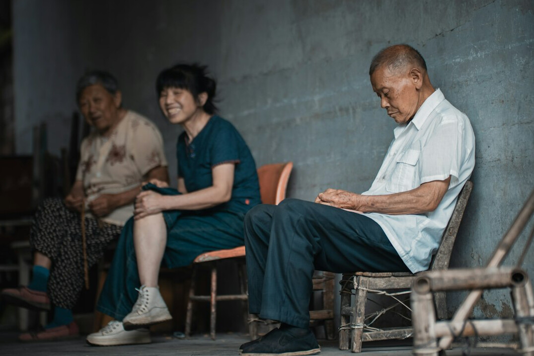 Insurance advisor consulting with an elderly Asian couple